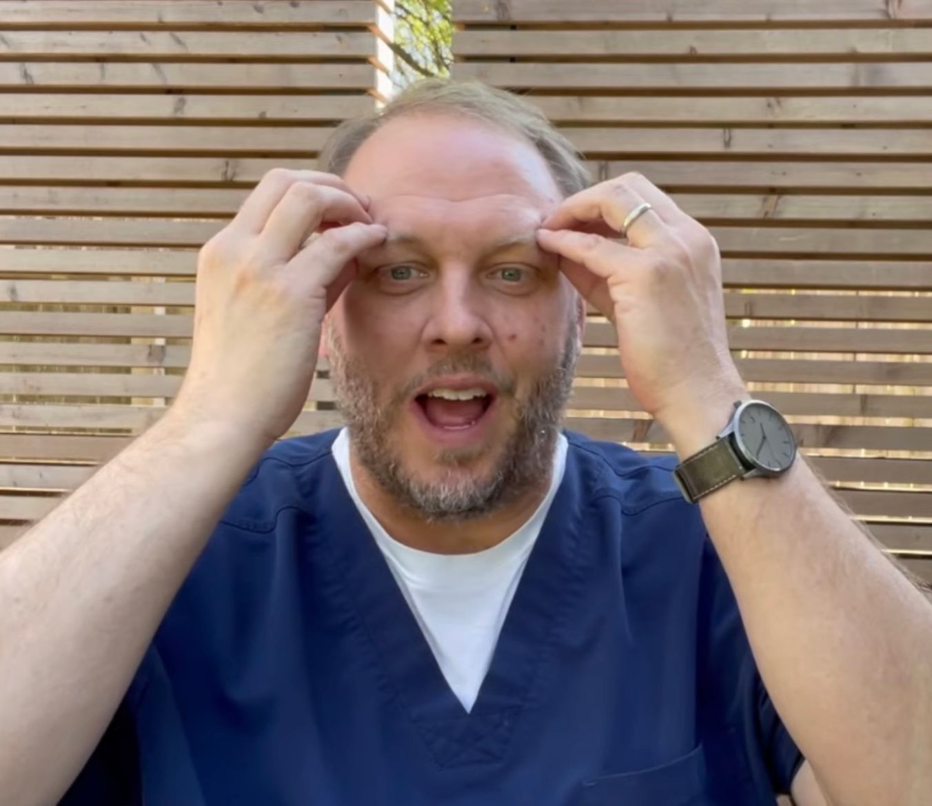 stephen dunn holding his front head Occipital Neuralgia Exercises, Stretches for Occipital Neuralgia  Image 1